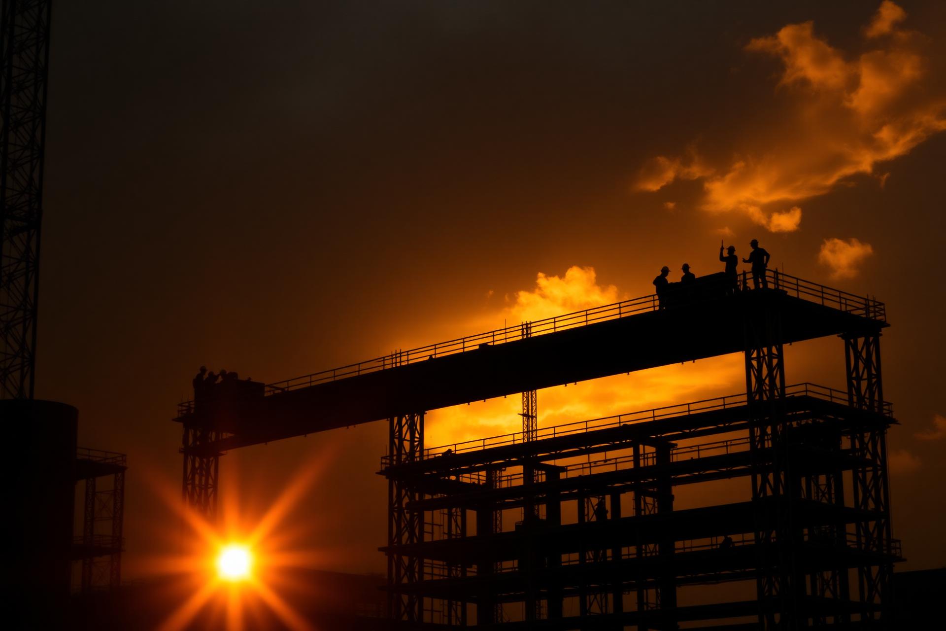 Steel structure under construction at golden hour